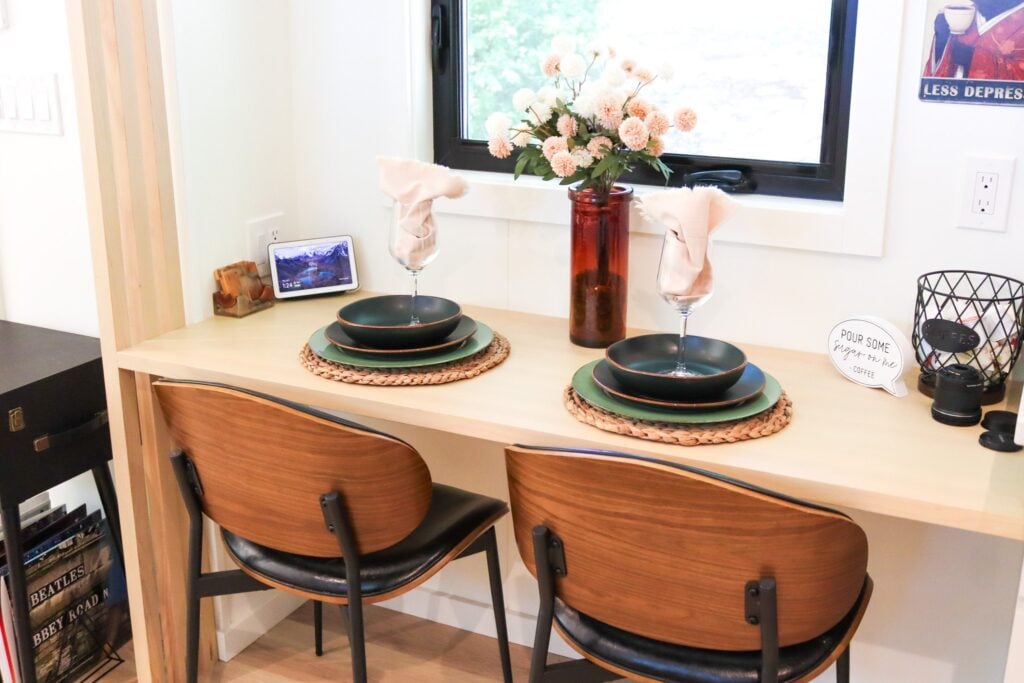 The dining nook set for two beside the window