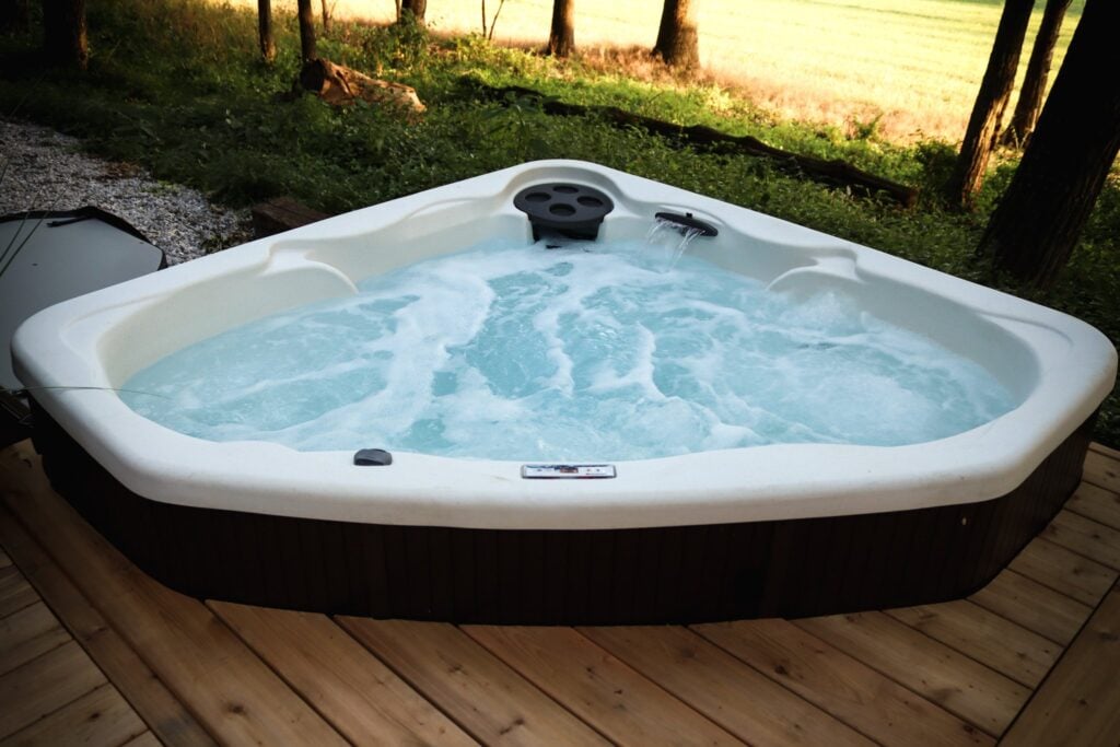 The hot tub on the deck at dusk