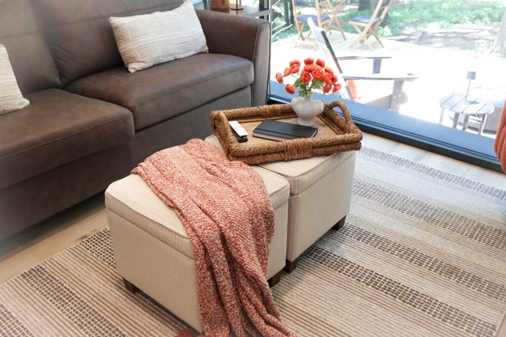 The sofa looking out toward the deck and hot tub
